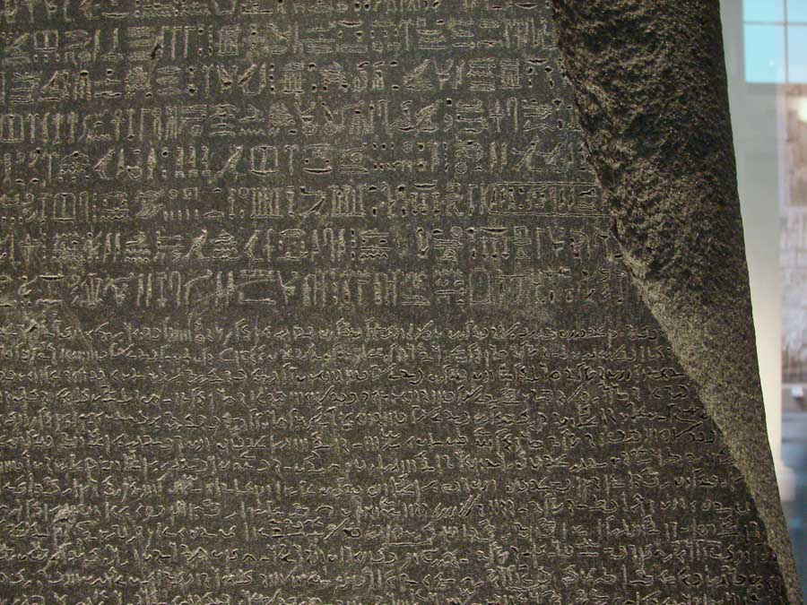 The Rosetta Stone — a single decree carved in hieroglyphic, Demotic, and Greek.