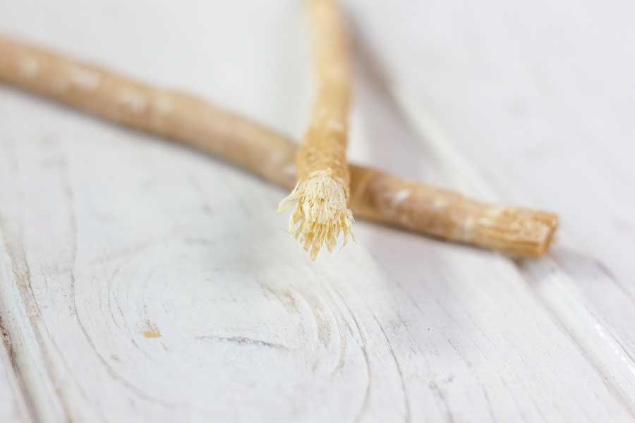 A miswak, or siwak — the chewed-twig toothstick, still sold and used today.