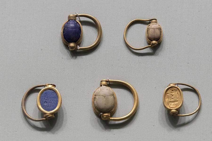 Gold rings set with scarabs, worn as jewelry, seal, and signature at once.